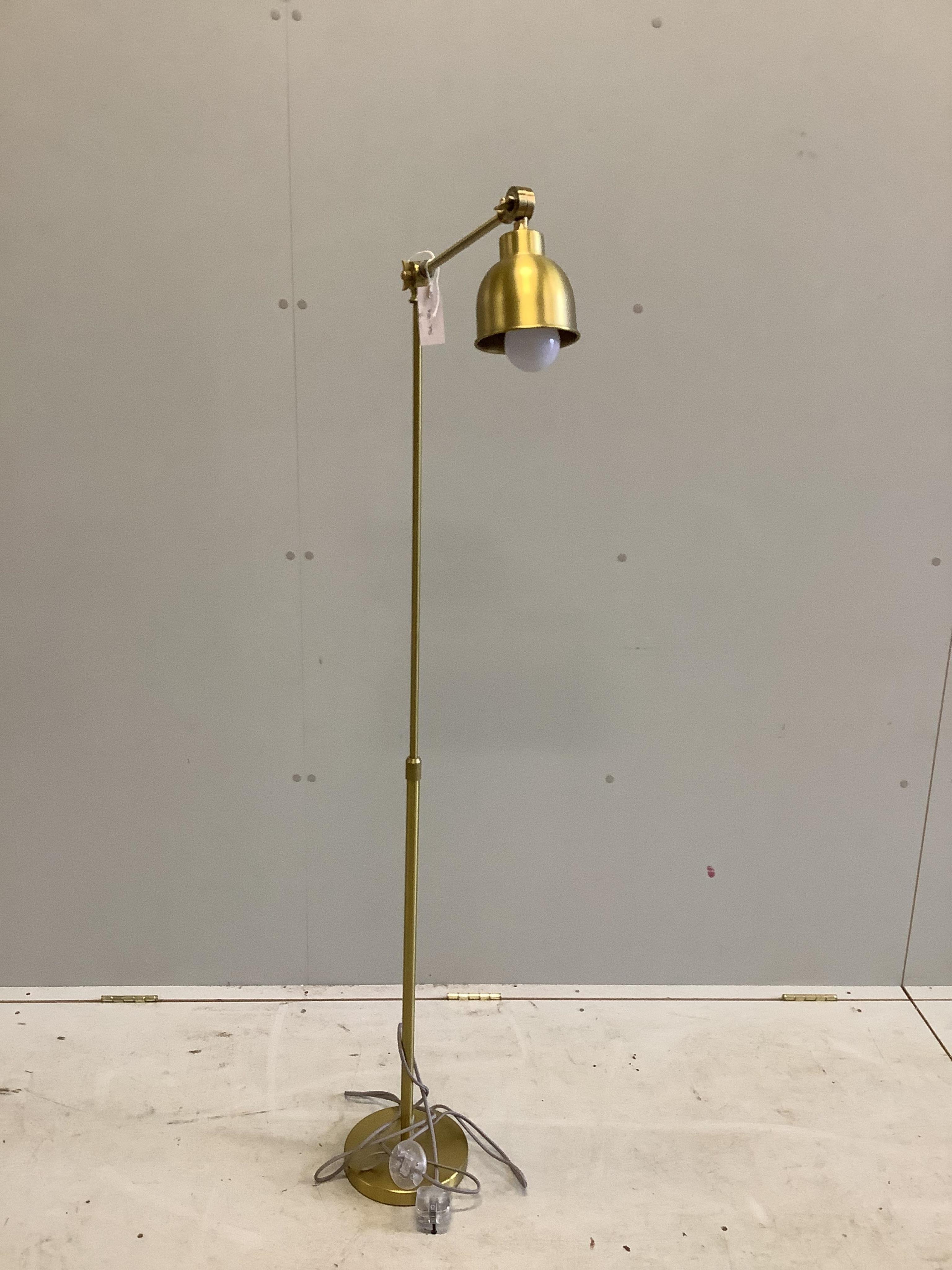 A Contemporary gilt metal adjustable floor lamp, height 143cm. Condition - good